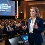 Professional corporate event speaker on stage in Perth